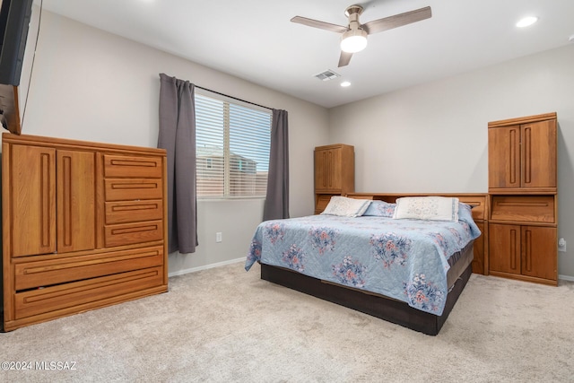 bedroom with light colored carpet and ceiling fan