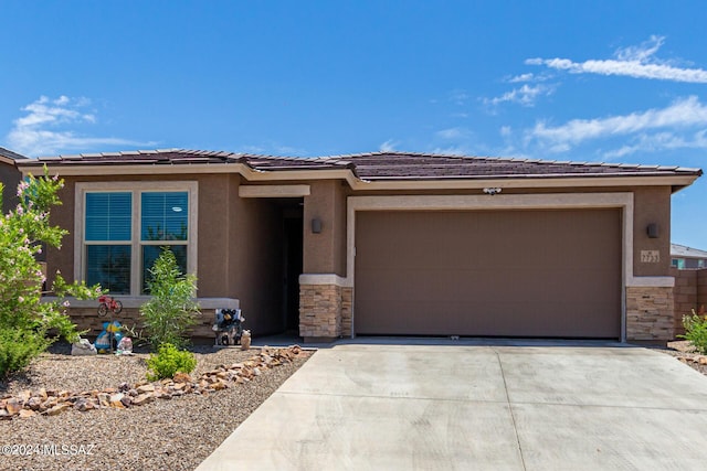 prairie-style house featuring a garage