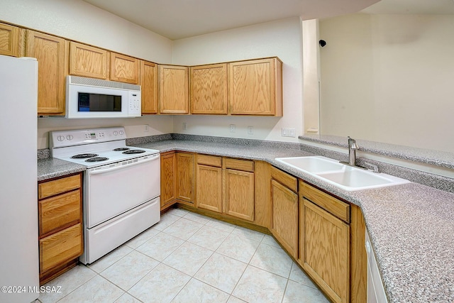 kitchen with sink, light tile patterned flooring, and white appliances