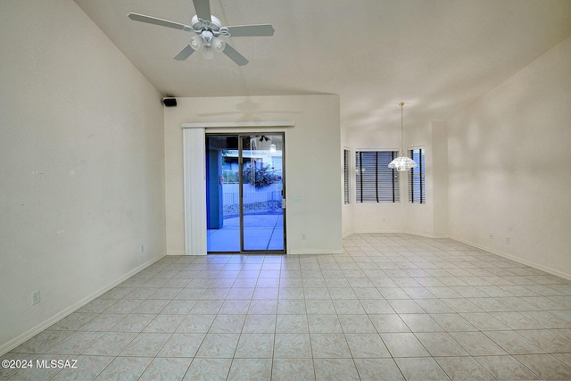 tiled empty room featuring ceiling fan with notable chandelier