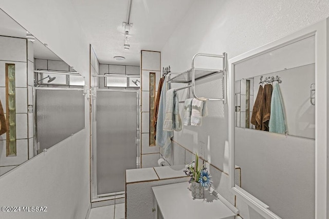 bathroom featuring a stall shower and tile patterned floors