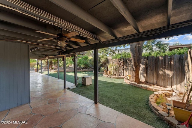 view of patio featuring fence and a ceiling fan