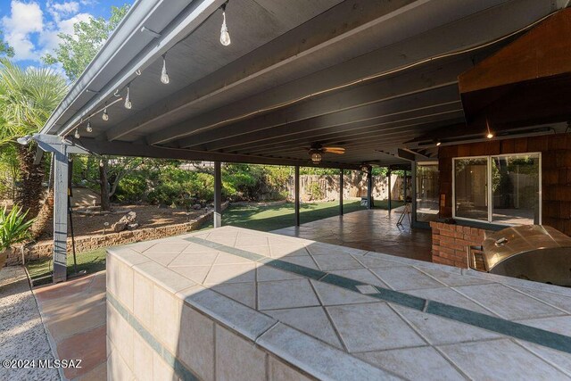 view of patio / terrace featuring ceiling fan