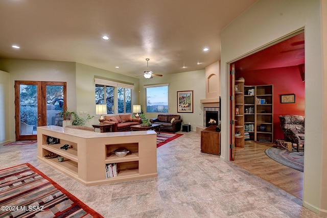 living room featuring light hardwood / wood-style floors and ceiling fan