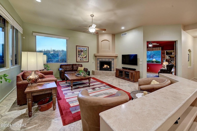 living area featuring recessed lighting, visible vents, ceiling fan, and a fireplace