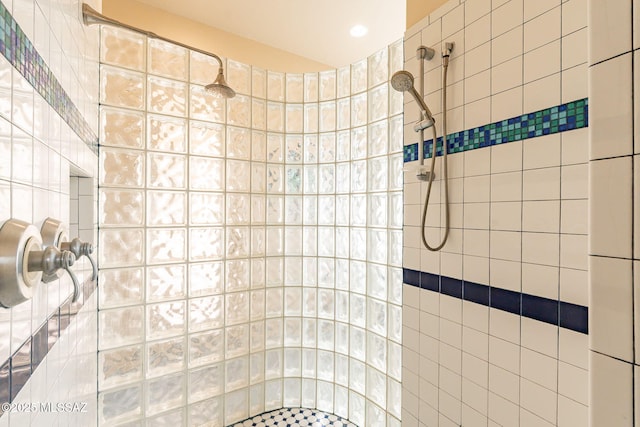 bathroom with a tile shower