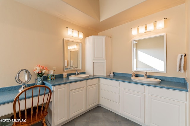 bathroom featuring tile patterned flooring and vanity