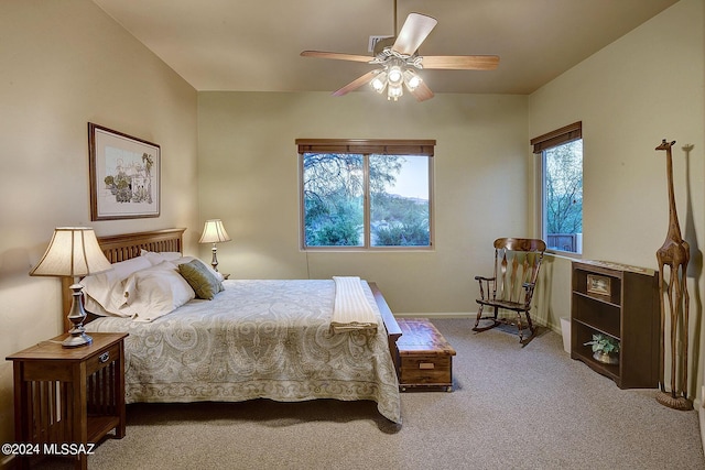 bedroom featuring light colored carpet and ceiling fan