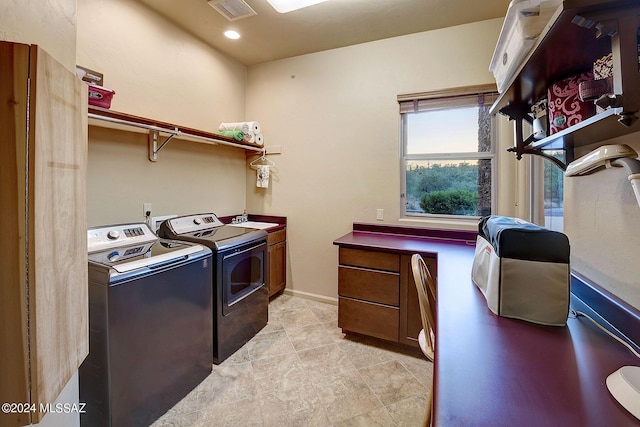 laundry room with cabinets, independent washer and dryer, and sink