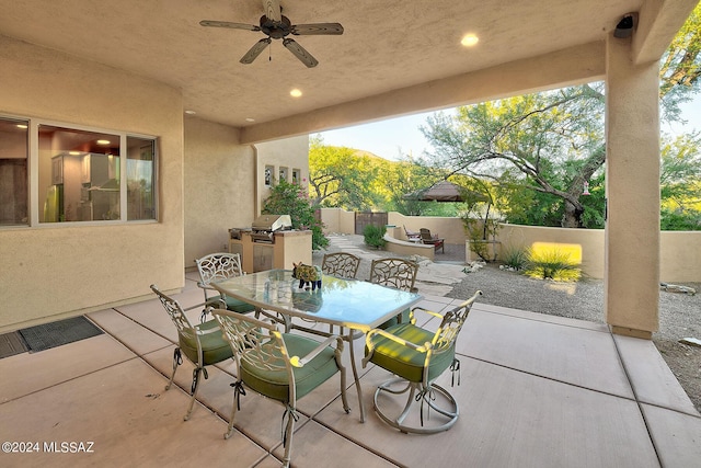 view of patio with area for grilling, grilling area, and ceiling fan