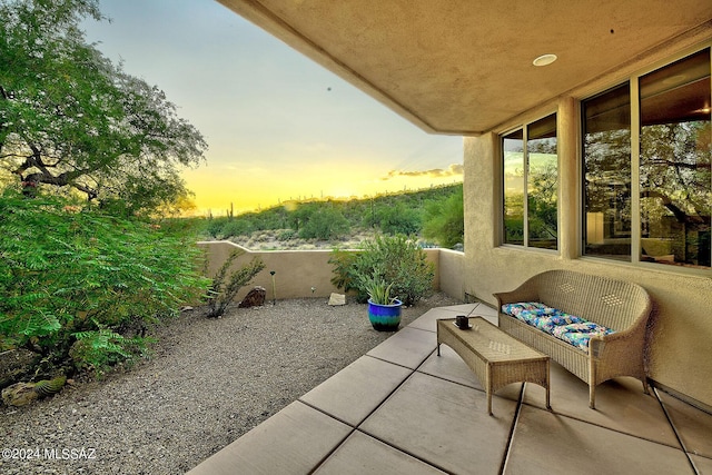 view of patio terrace at dusk