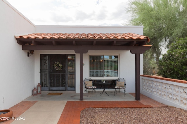 entrance to property with a patio