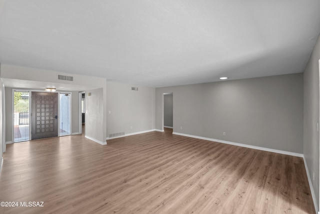 unfurnished living room with light hardwood / wood-style floors