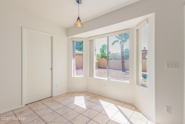 spare room featuring light tile patterned floors