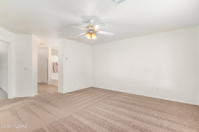 carpeted empty room with ceiling fan