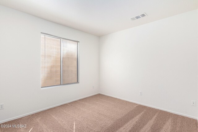 unfurnished room with carpet flooring