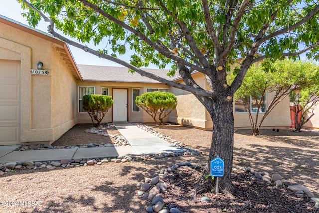 doorway to property with a garage