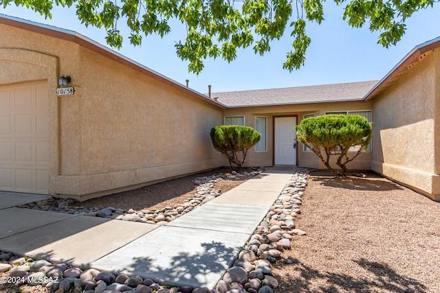 property entrance featuring a garage