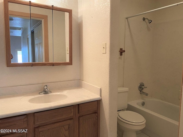 full bathroom with vanity, washtub / shower combination, and toilet