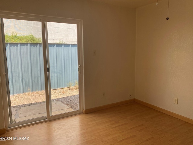 unfurnished room featuring light wood-type flooring