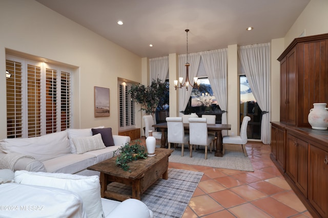 living room with a notable chandelier and light tile patterned flooring