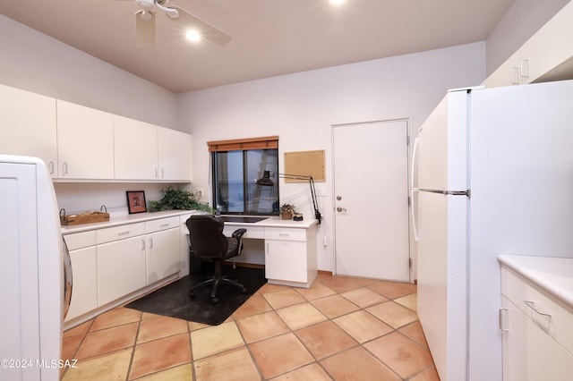 tiled home office with built in desk and ceiling fan