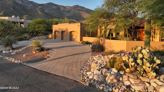 southwest-style home with a mountain view and a garage