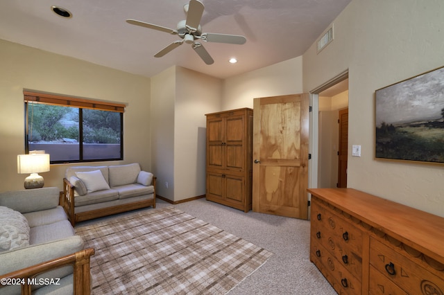 living room featuring light colored carpet and ceiling fan