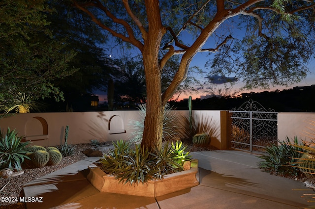 view of patio terrace at dusk