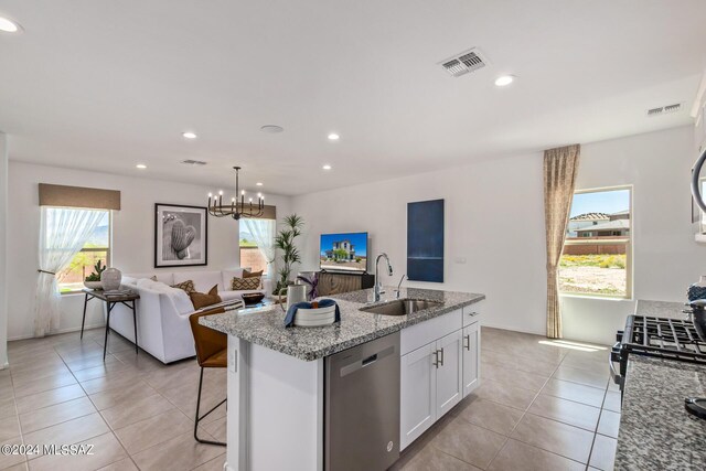 dining room featuring light tile patterned flooring, a mountain view, and a notable chandelier