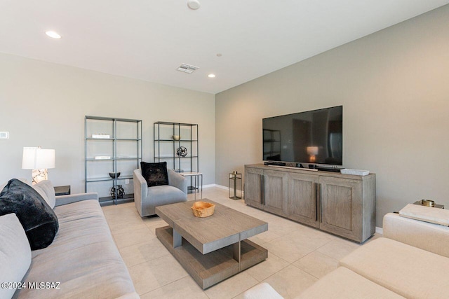 living room with recessed lighting, visible vents, baseboards, and light tile patterned floors