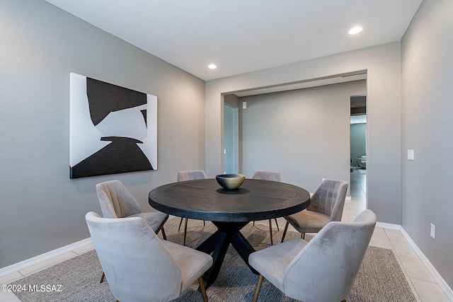 dining space with recessed lighting, light tile patterned flooring, and baseboards