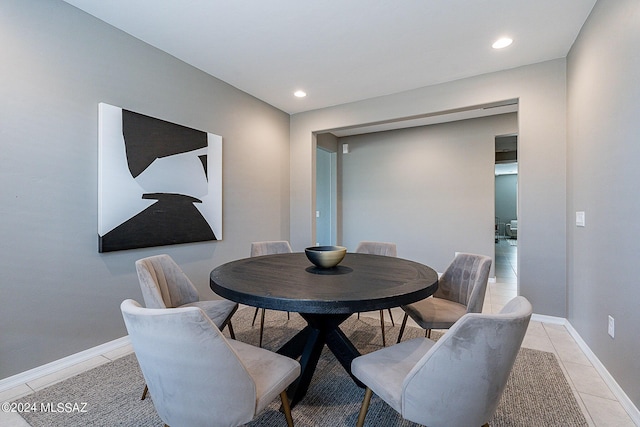 dining room with baseboards, recessed lighting, and light tile patterned flooring