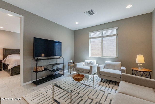 living area featuring recessed lighting, visible vents, baseboards, and light tile patterned floors