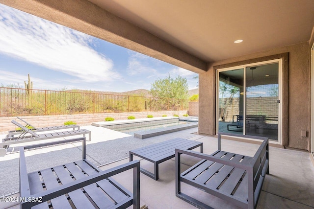 view of patio featuring a fenced in pool and a fenced backyard