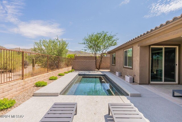 view of pool featuring a fenced in pool, a patio area, and a fenced backyard