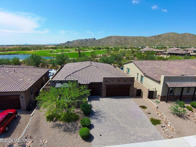 bird's eye view featuring a residential view and a water and mountain view