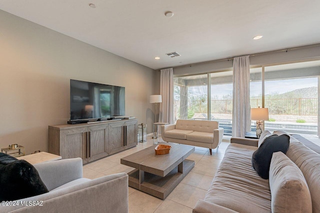 living area with recessed lighting, visible vents, plenty of natural light, and light tile patterned floors