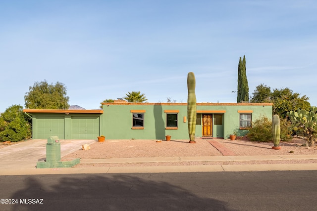 single story home with a garage