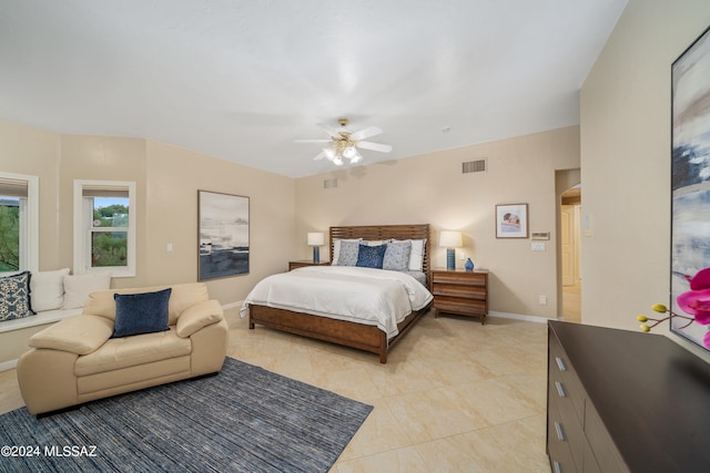 tiled bedroom with ceiling fan