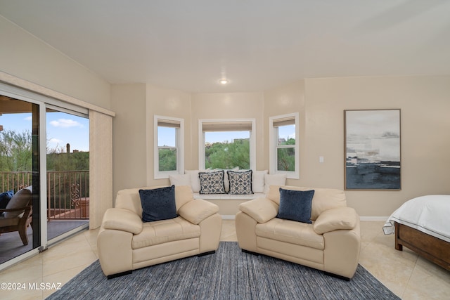 bedroom with light tile patterned flooring and access to exterior