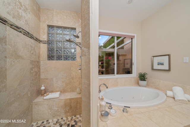 bathroom featuring independent shower and bath