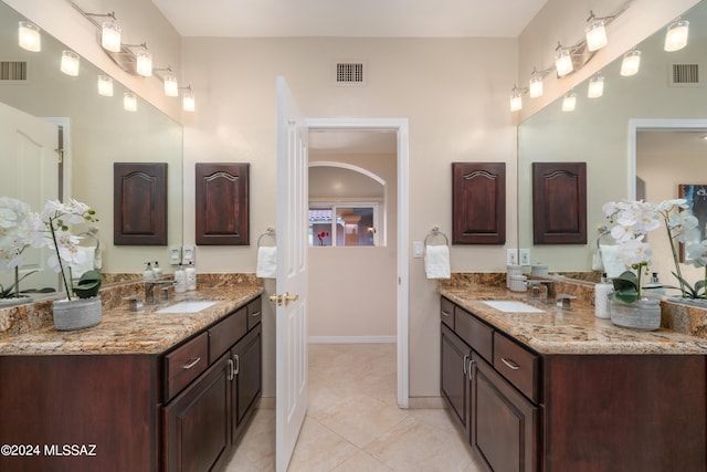 bathroom with vanity and tile patterned flooring