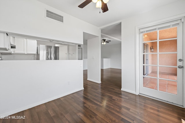 unfurnished room featuring ceiling fan and dark hardwood / wood-style floors