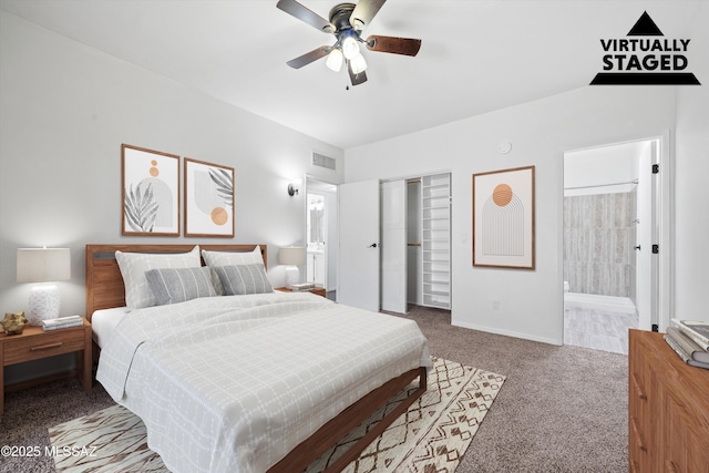 bedroom featuring ceiling fan, ensuite bath, carpet floors, and a closet