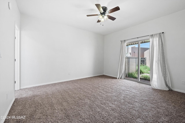 spare room featuring carpet flooring and ceiling fan