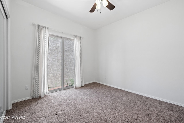 unfurnished room featuring ceiling fan and carpet flooring