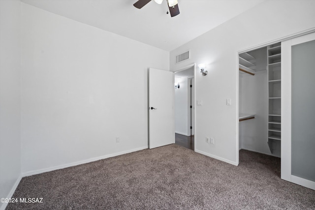 unfurnished bedroom featuring ceiling fan, carpet flooring, and a closet