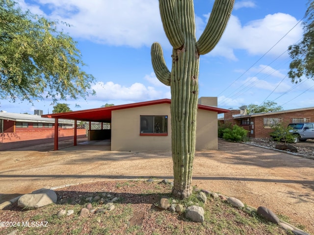 exterior space featuring a carport