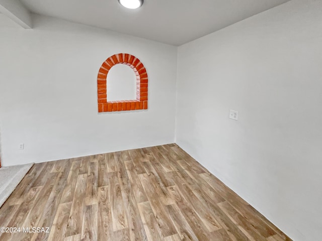 empty room featuring wood-type flooring